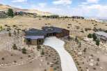 Experience luxury living in this stunning modern home nestled on a hillside with panoramic views.