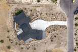 Discover this stunning modern home featuring a multi-level dark shingle roof and a sleek metal roof accent.