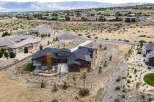 Experience luxury living in this stunning modern home nestled in a picturesque hillside community.