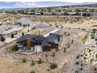 Experience luxury living in this stunning modern home nestled in a picturesque hillside community.
