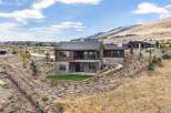 Experience modern luxury in this stunning home, featuring a striking wood and stucco exterior that complements the natural desert landscape.