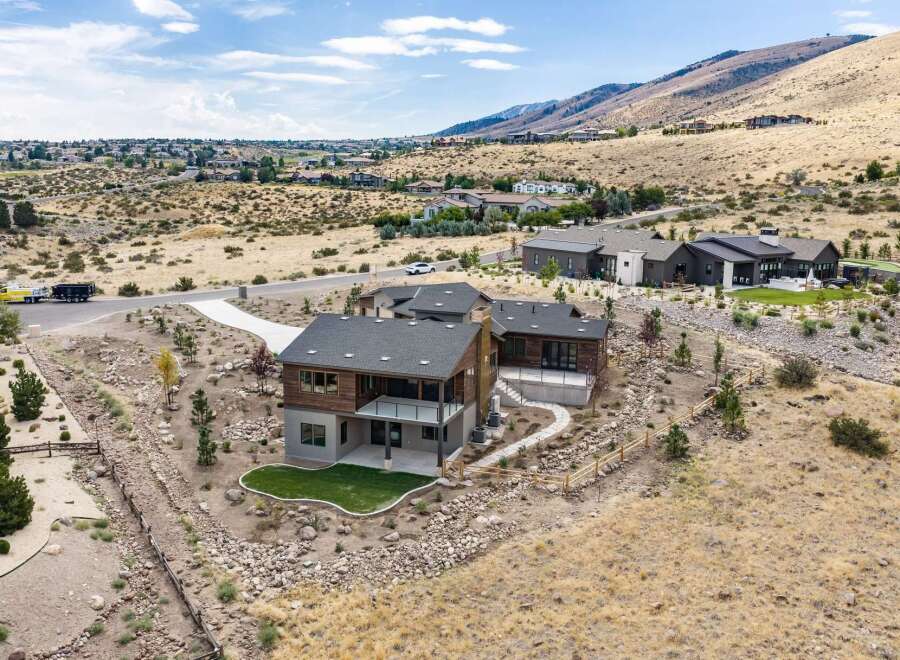 Discover modern luxury living in this stunning home nestled in a picturesque hillside community.