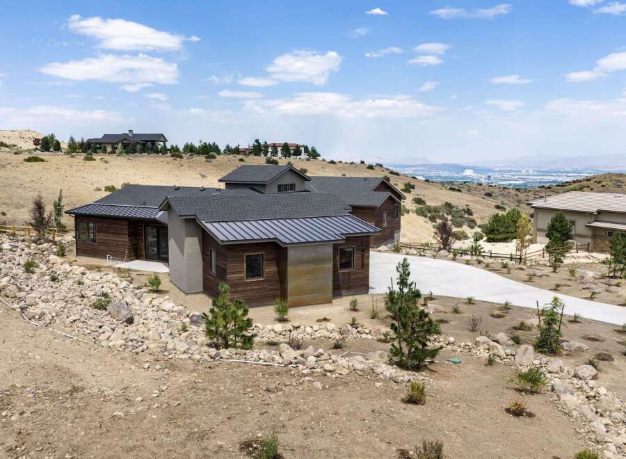 Discover modern luxury in this stunning home, featuring a striking architectural design with natural wood and metal accents.