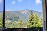 Experience breathtaking mountain views from this charming property, nestled amidst lush greenery and traditional alpine architecture.