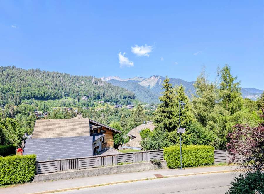 Nestled amidst lush greenery and offering breathtaking mountain views, this property boasts charming chalets with traditional wooden architecture.