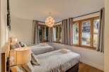 This charming bedroom features two comfortable twin beds, perfect for guests or a family.