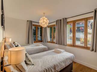 This charming bedroom features two comfortable twin beds, perfect for guests or a family.