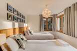 This charming bedroom features two comfortable beds, perfect for families or groups.