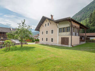 Nestled in a picturesque mountain setting, this charming property offers a serene escape.