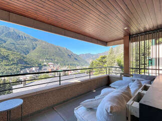 Experience breathtaking mountain views from this stunning balcony, perfect for enjoying your morning coffee or evening relaxation.