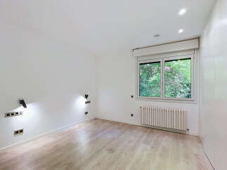 Discover this bright and airy room featuring a large window with lush green views, perfect for bringing the outdoors in.
