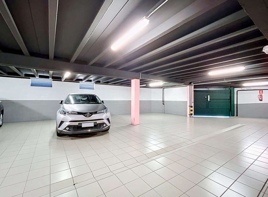 Discover this spacious and well-lit underground parking garage, perfect for secure vehicle storage.