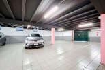 Discover this spacious and well-lit underground parking garage, perfect for secure vehicle storage.