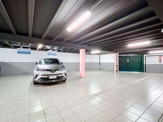 Discover this spacious and well-lit underground parking garage, perfect for secure vehicle storage.