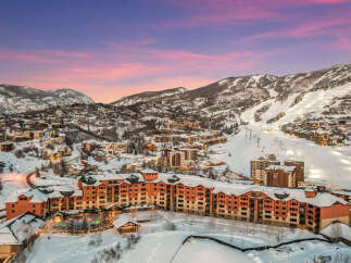 Experience luxury mountain living with this stunning ski-in/ski-out property, offering breathtaking views of the slopes and surrounding peaks.