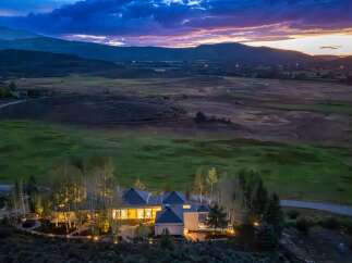 Experience luxury living in this stunning estate nestled amidst rolling hills and majestic mountains.