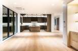 Experience modern luxury in this stunning open-concept kitchen and living area.