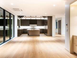 Experience modern luxury in this stunning open-concept kitchen and living area.