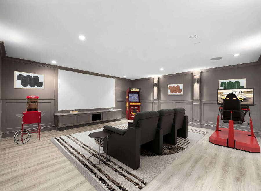 Experience ultimate entertainment in this dedicated home theater and gaming room.