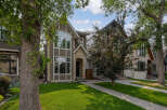 Discover modern living in this stunning multi-level home, featuring a striking stone and stucco exterior.