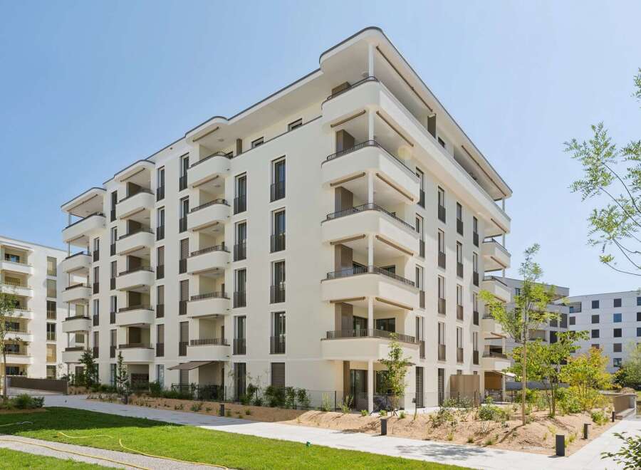 Discover modern living in this stunning apartment complex featuring a sleek, contemporary design.