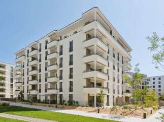 Discover modern living in this stunning apartment complex featuring a sleek, contemporary design.