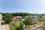 Discover modern living in this contemporary apartment complex, featuring sleek architecture and spacious balconies perfect for enjoying the serene surroundings.