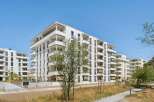 Discover modern living in this stunning new construction apartment complex, featuring sleek white exteriors and abundant private balconies.