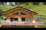 Experience luxury mountain living in this stunning wooden chalet, featuring a spacious deck with a hot tub and breathtaking panoramic views.