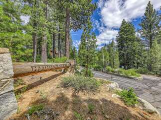 Discover this stunning property nestled within a serene, wooded landscape, offering privacy and natural beauty.