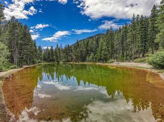 Discover a serene oasis with this stunning natural hot spring, perfect for relaxation and rejuvenation.