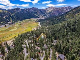 Nestled amidst a lush pine forest, this stunning property offers a serene mountain retreat.