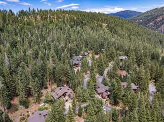 Nestled amidst a dense forest of mature pine trees, this property offers a serene mountain retreat.