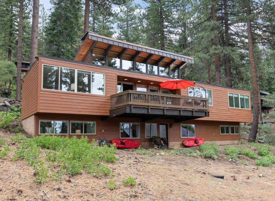 Experience modern living nestled in a serene forest setting with this stunning multi-level home.