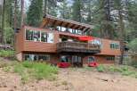 Experience modern living nestled in a serene forest setting with this stunning multi-level home.