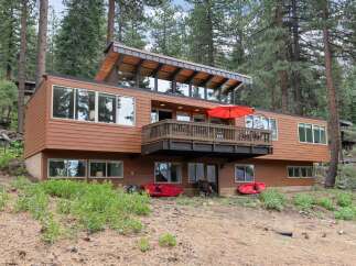 Experience modern living nestled in a serene forest setting with this stunning multi-level home.