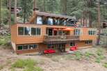 Experience modern living in this stunning multi-level home nestled among tall pine trees.