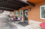 Enjoy outdoor living on this charming covered patio, perfect for relaxing with a view.