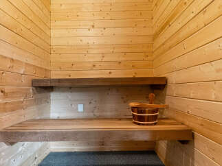 Experience ultimate relaxation in this beautifully crafted wooden sauna.