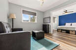 Discover comfort and style in this inviting living space, featuring a plush grey sofa and a modern coffee table.
