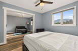 Experience comfort and style in this inviting bedroom, featuring a plush mattress and a serene blue-gray color palette.