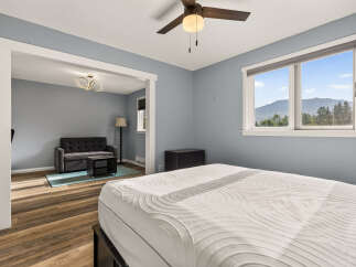 Experience comfort and style in this inviting bedroom, featuring a plush mattress and a serene blue-gray color palette.