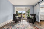 Relax in comfort in this inviting living space, featuring two plush armchairs perfect for unwinding.