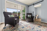 Relax in comfort in this inviting living space, featuring two plush armchairs perfect for unwinding.