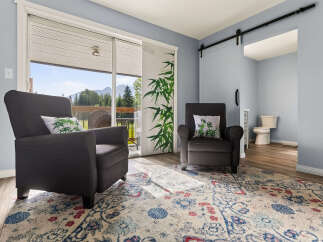 Relax in comfort in this inviting living space, featuring two plush armchairs perfect for unwinding.