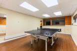 Enjoy endless fun in this spacious recreational room, perfect for hosting game nights or unwinding after a long day.