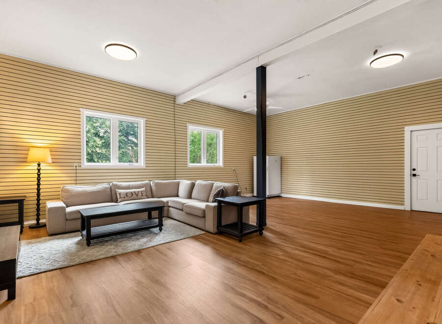 This spacious living area features a comfortable sectional sofa, perfect for relaxing or entertaining guests.