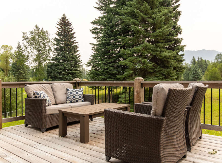 Enjoy the outdoors from this spacious wooden deck, perfect for entertaining or relaxing.