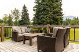 Enjoy the outdoors from this spacious wooden deck, perfect for entertaining or relaxing.