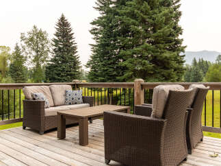 Enjoy the outdoors from this spacious wooden deck, perfect for entertaining or relaxing.